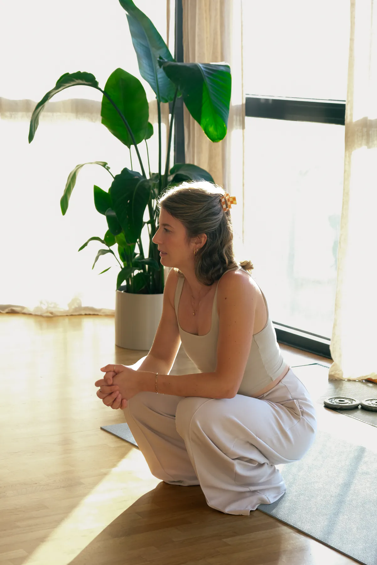 Open hands resting on a mat